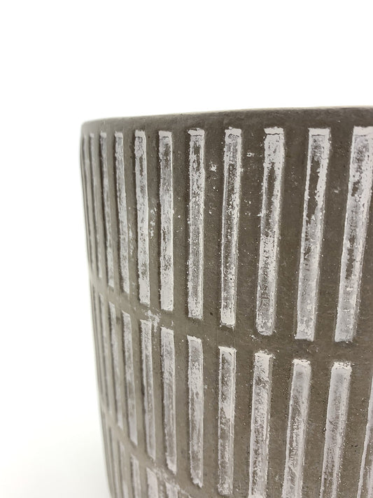Side view of The Fresh Face cement planter showing its vertical textured pattern.