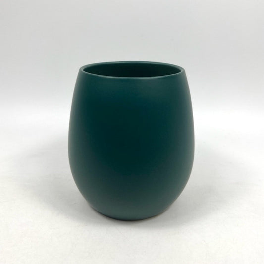 The Friendly Face teal matte planter with a rounded silhouette, photographed on a clean white background.