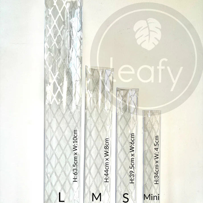 Set of clear acrylic stands with leafy branding and dimensions on a white background