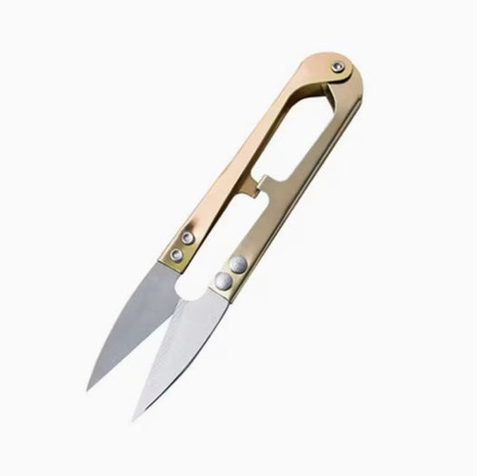 The Mini Snip Tool — stainless-steel pocket pruning shears with a gold handle on a white background.