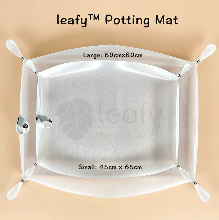 White potting mat with 'leafy' branding on a beige background