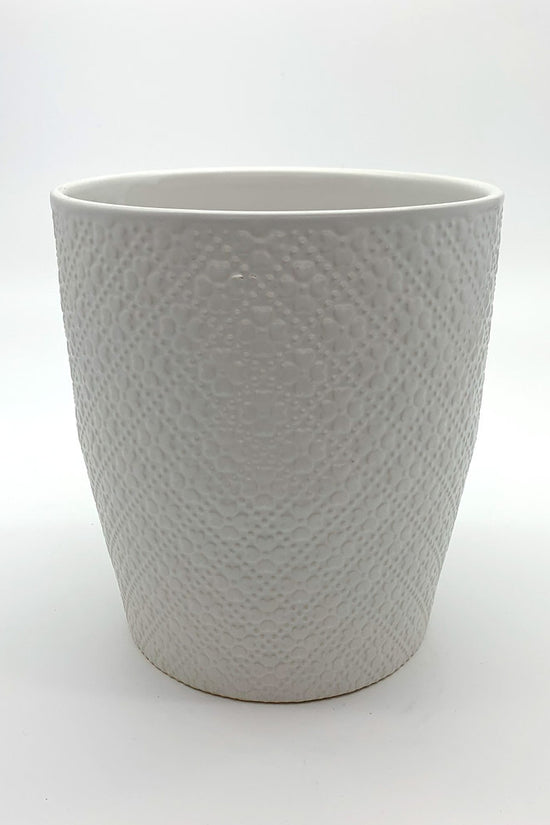 Textured white indoor planter with a rounded shape, photographed on a clean white background.
