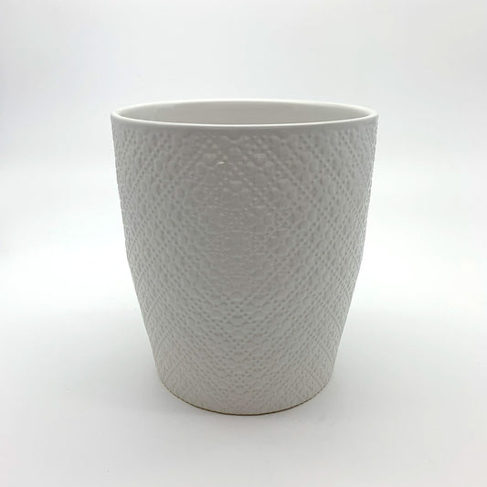 Textured white indoor planter with a rounded shape, photographed on a clean white background.
