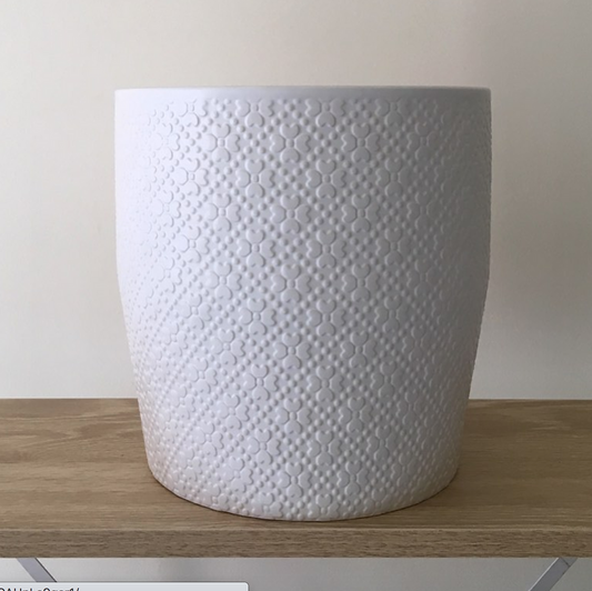 Large textured white ceramic planter from Potted & Co., displayed on a wooden surface.