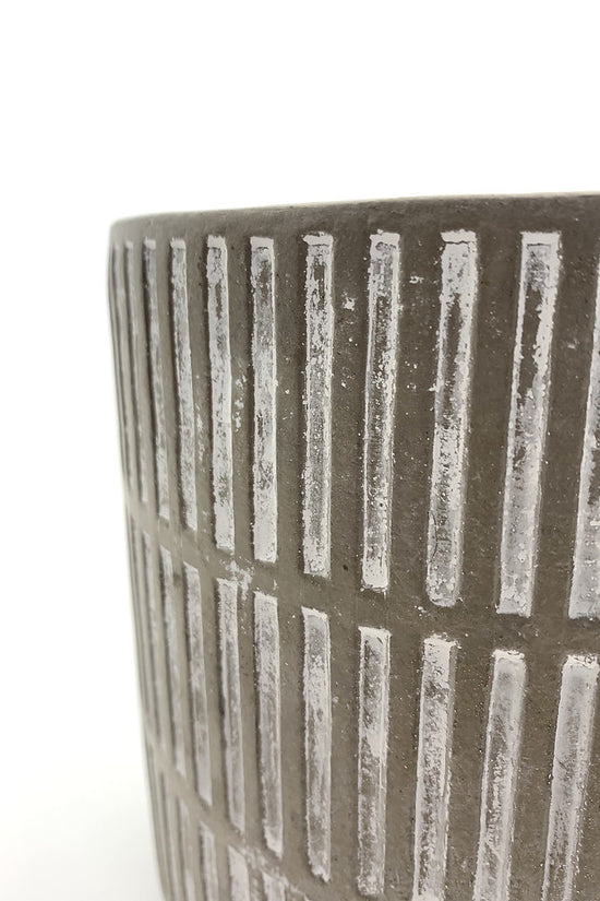 Side view of The Fresh Face cement planter showing its vertical textured pattern.