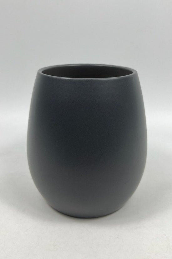 The Friendly Face charcoal matte planter with a rounded, modern silhouette photographed against a white backdrop.