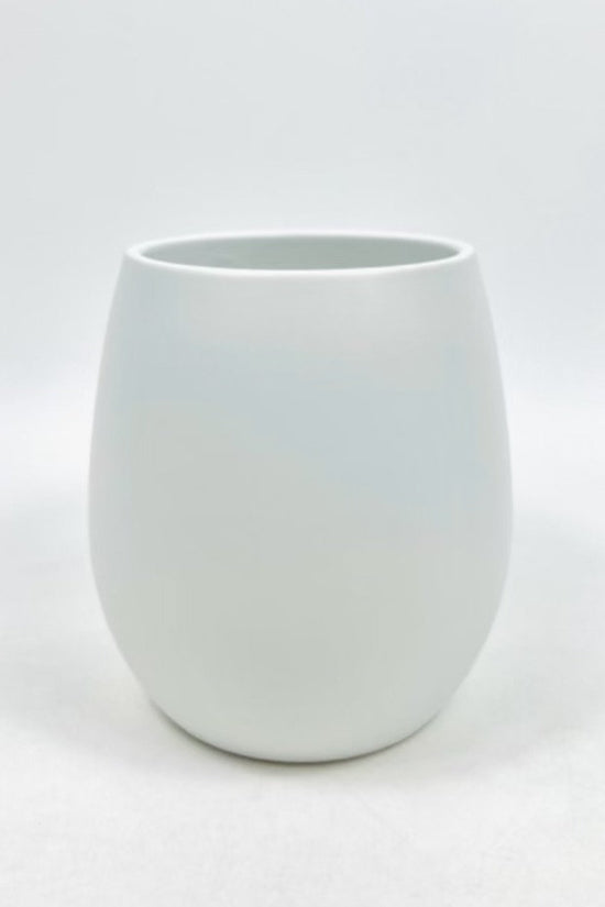 The Friendly Face white matte ceramic planter featuring a smooth curved shape on a clean white background.