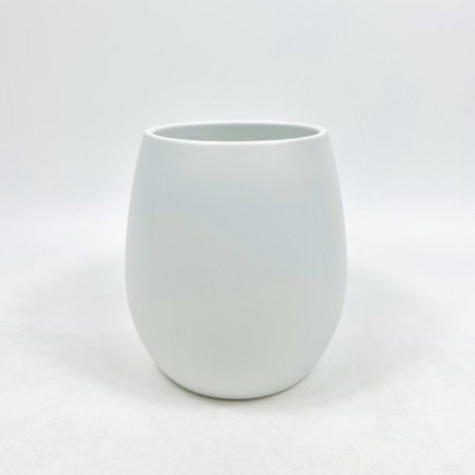 The Friendly Face white matte ceramic planter featuring a smooth curved shape on a clean white background.