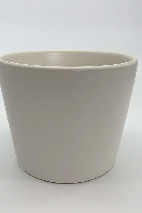 The Glow Getter white glazed ceramic planter with a glossy finish, photographed against a clean white background.