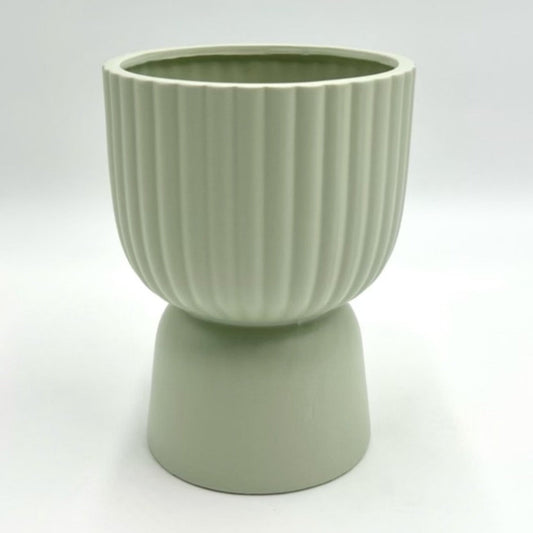 The Good Egg cucumber green ribbed planter with a raised pedestal base, photographed on a clean white background.