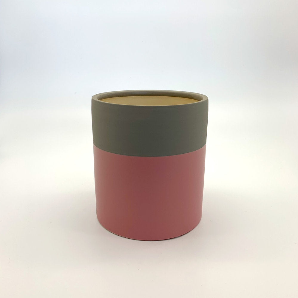 The Mood Booster planter featuring a matte two-tone colour-block design in pink and olive, photographed on a clean white background.