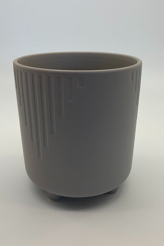 The Overachiever taupe grey ribbed ceramic planter with a matte finish, photographed on a clean white background.
