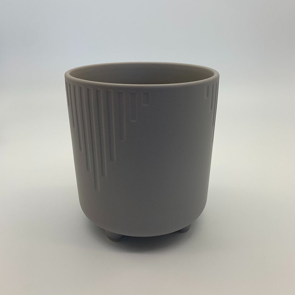 The Overachiever taupe grey ribbed ceramic planter with a matte finish, photographed on a clean white background.