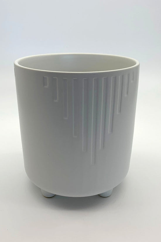 The Overachiever white matte planter with vertical ribbing and rounded base, shown on a white backdrop.