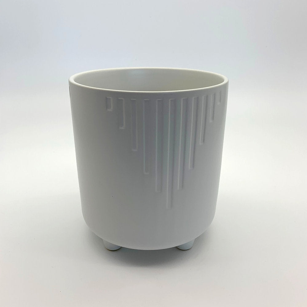 The Overachiever white matte planter with vertical ribbing and rounded base, shown on a white backdrop.