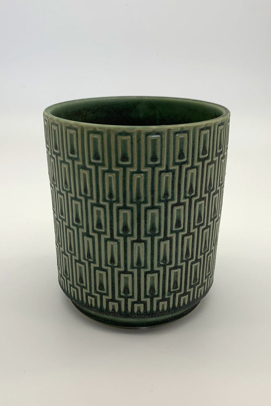 The Side Table Star planter in muted teal with geometric pattern photographed on a clean white background.