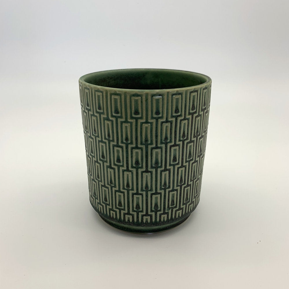 The Side Table Star planter in muted teal with geometric pattern photographed on a clean white background.