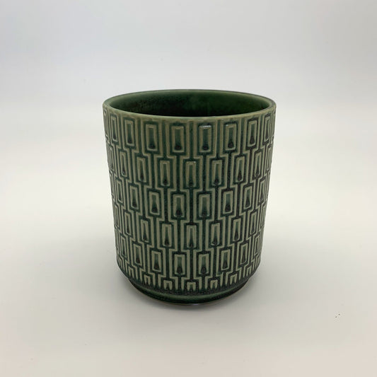 The Side Table Star planter in muted teal with geometric pattern photographed on a clean white background.