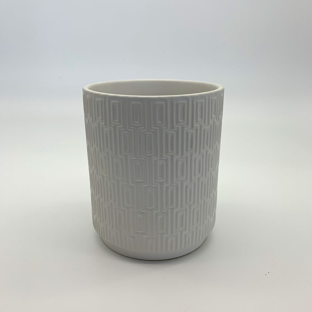 The Side Table Star white geometric planter photographed front-on against a plain white background.