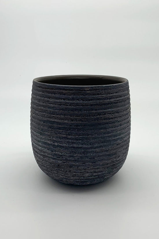 The Sidekick charcoal grey planter with rounded silhouette and textured finish photographed on white.