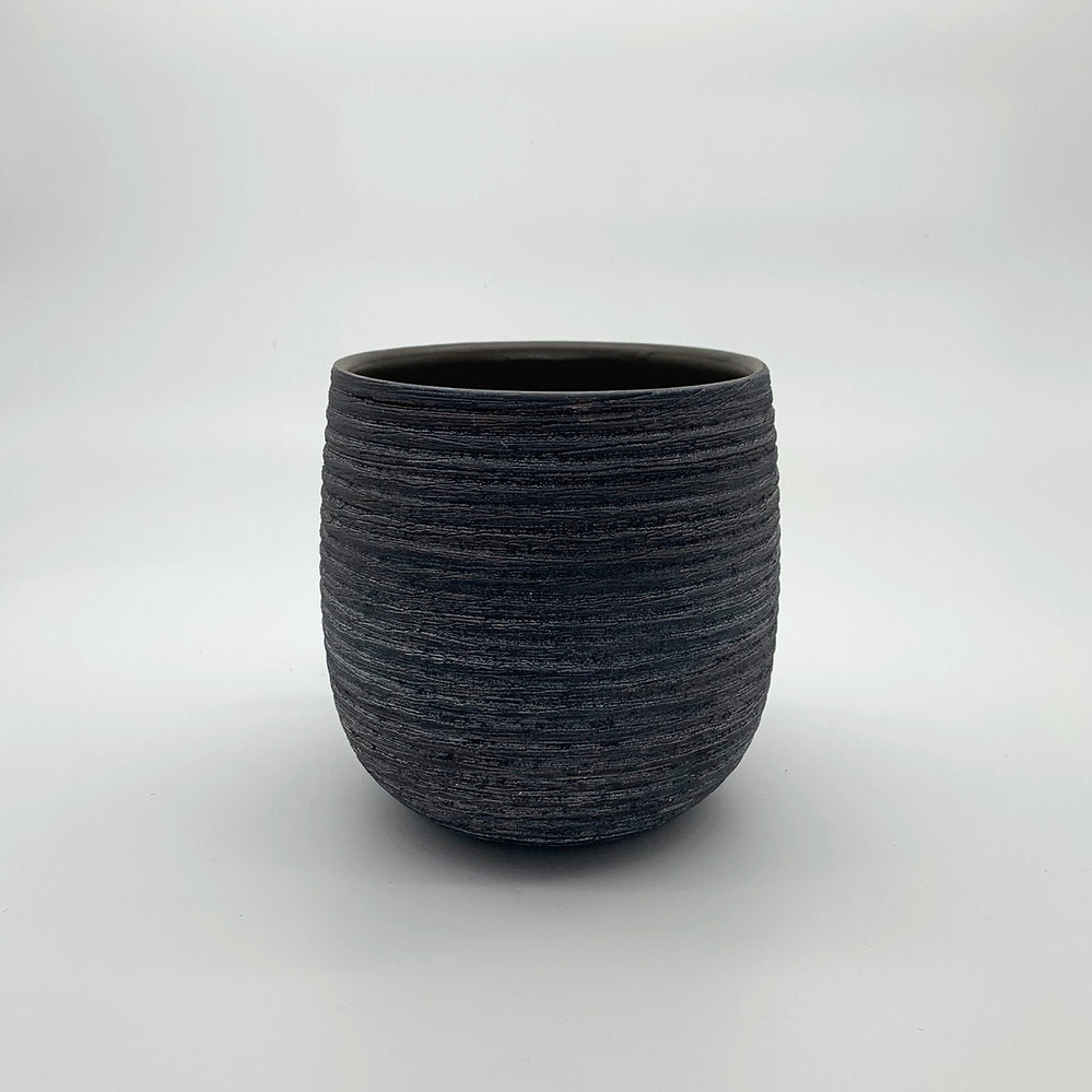The Sidekick charcoal grey planter with rounded silhouette and textured finish photographed on white.