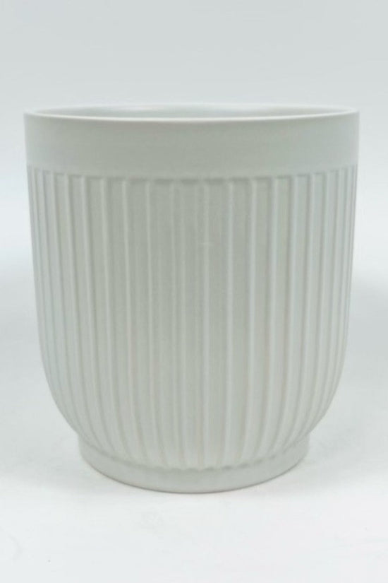 The Soft Shape planter in matte white with soft vertical ribbing photographed against a plain white background.