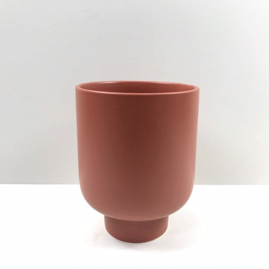 The Sunday Pot in terracotta with a smooth matte finish and pedestal base, photographed on a white background.