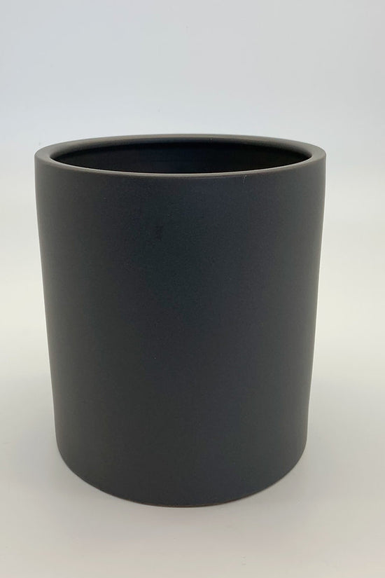 The Ultimate Roommate planter in matte grey with a simple rounded silhouette against a white backdrop.