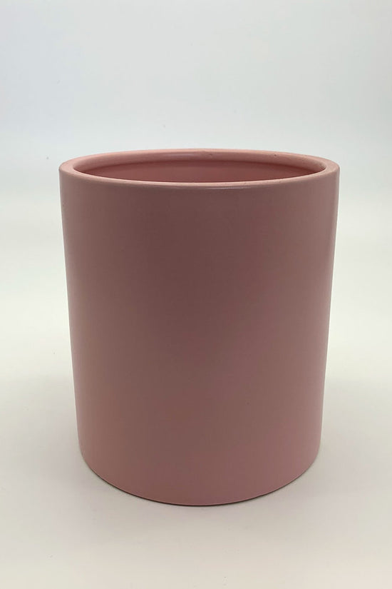The Ultimate Roommate planter in soft matte pink with a minimal cylindrical design photographed on a white background.