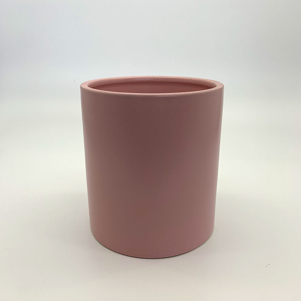 The Ultimate Roommate planter in soft matte pink with a minimal cylindrical design photographed on a white background.