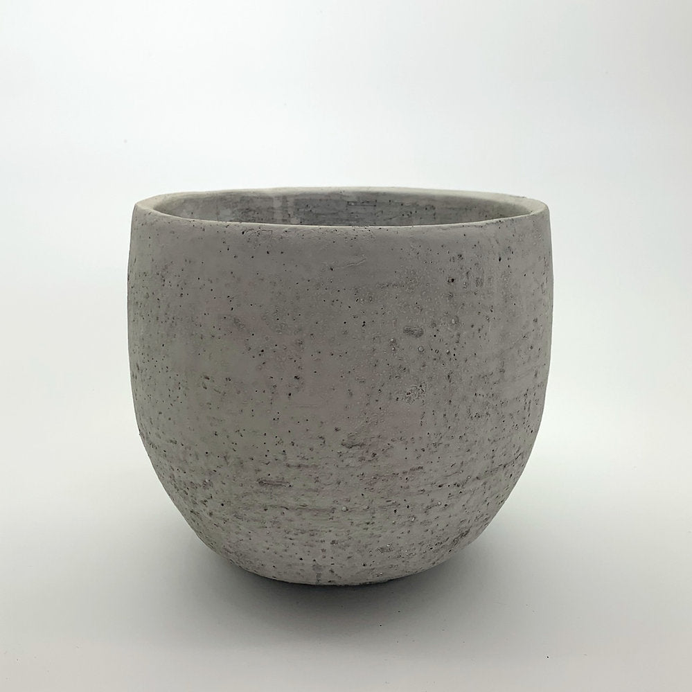 The Vibe Setter planter in natural cement with a smooth rounded shape, photographed on a clean white background.