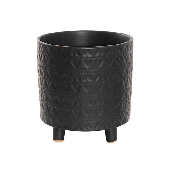 The Perfect Pair large matte black planter features subtle leaf-patterned texture and short, rounded feet.