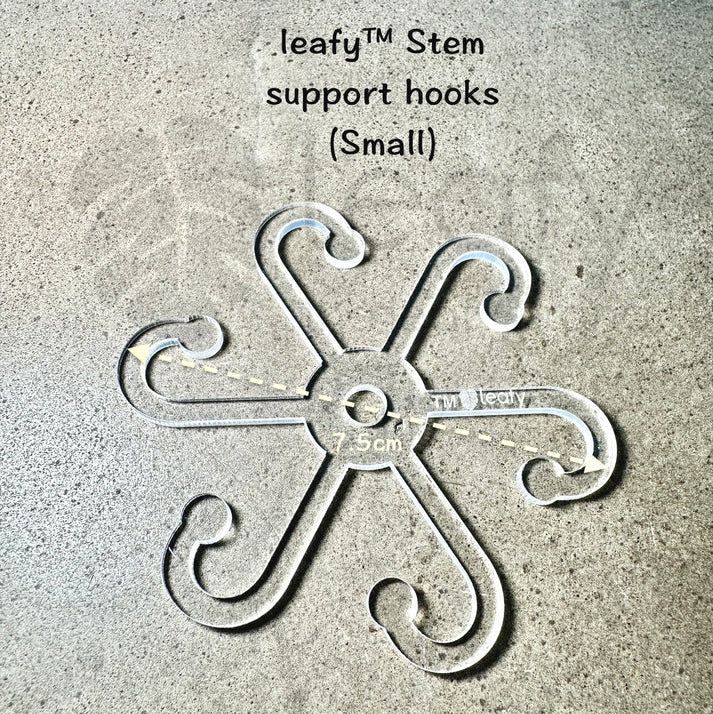 Decorative stem support hook labeled 'leafy Stem support hooks (Small)' on a textured surface.