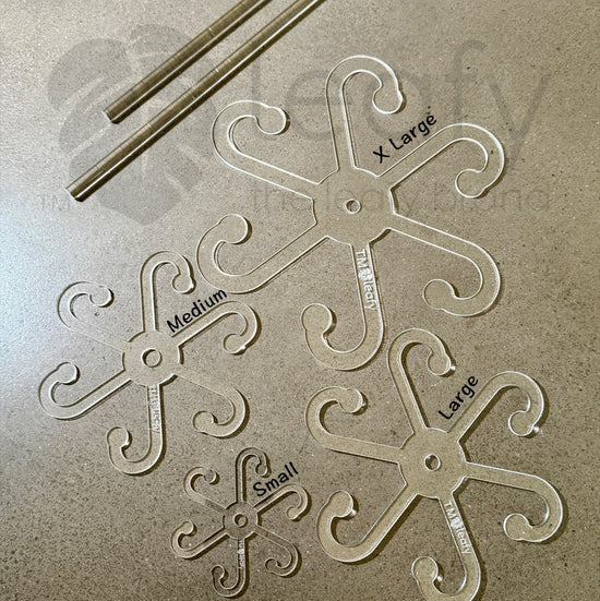 Leafy stem support hooks on a textured surface with 'leafy' branding.