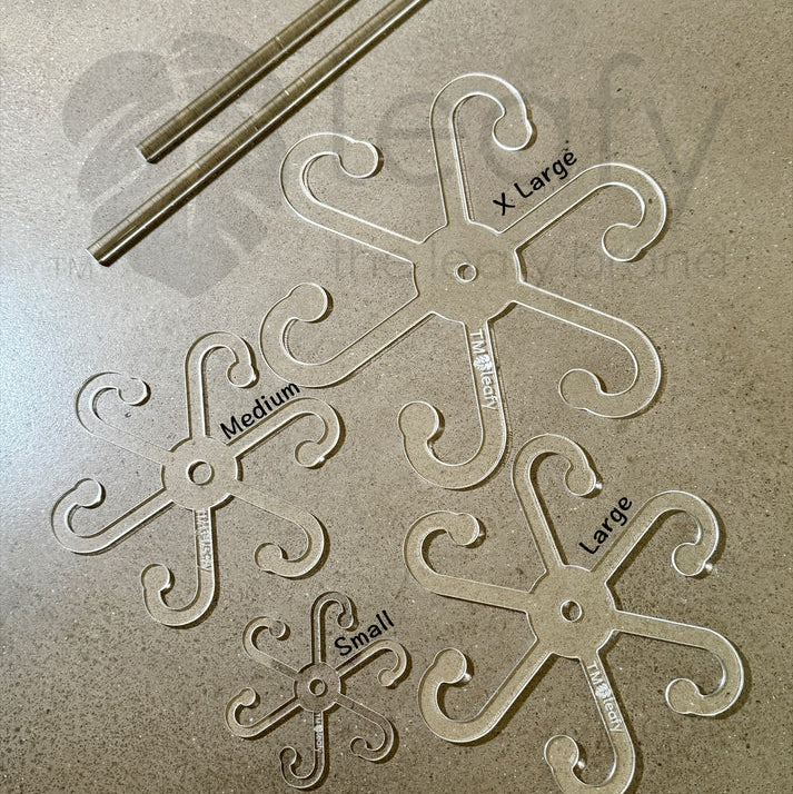 Leafy stem support hooks on a textured surface with 'leafy' branding.