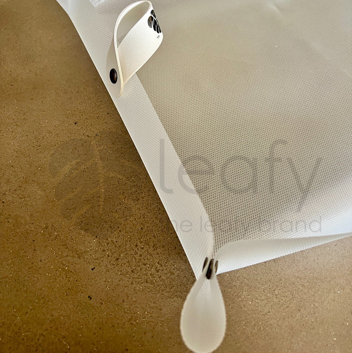 White mesh screen with attached frame on a beige background, featuring the 'leafy' brand.
