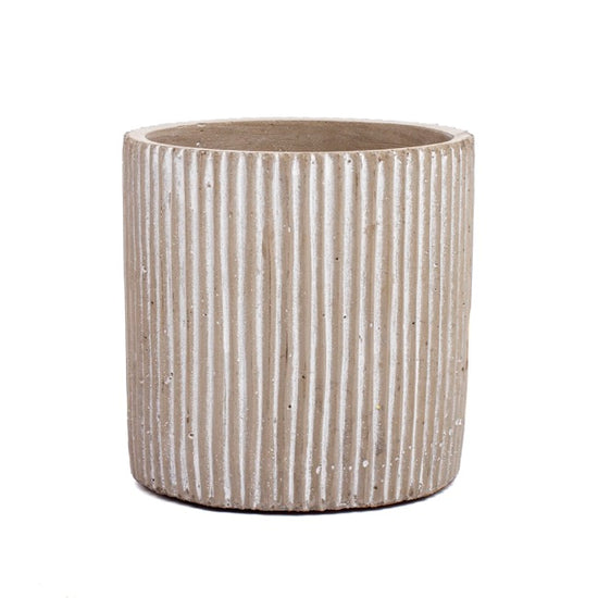 Textured ceramic planter on a white background