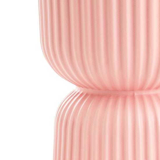 Side close-up of The Perfect Fit light-pink egg-cup–style planter, showing its stacked silhouette and ribbed finish.